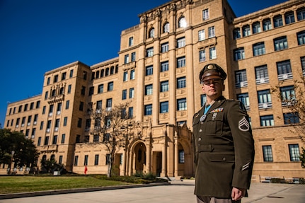 U.S. Army Soldier, Staff Sgt. Kevin Sims, training non-commissioned officer in charge of information and intelligence analysis with the 470th Military Intelligence Brigade, stands in front of the U.S. Army South Headquarters at Joint Base San Antonio - Fort Sam Houston, Texas, Jan. 12, 2022. Sims was inducted into the Sgt. Audie Murphy Club for his outstanding performance and leadership as a non-commissioned officer. (U.S. Army photo by Pfc. Joshua Taeckens)