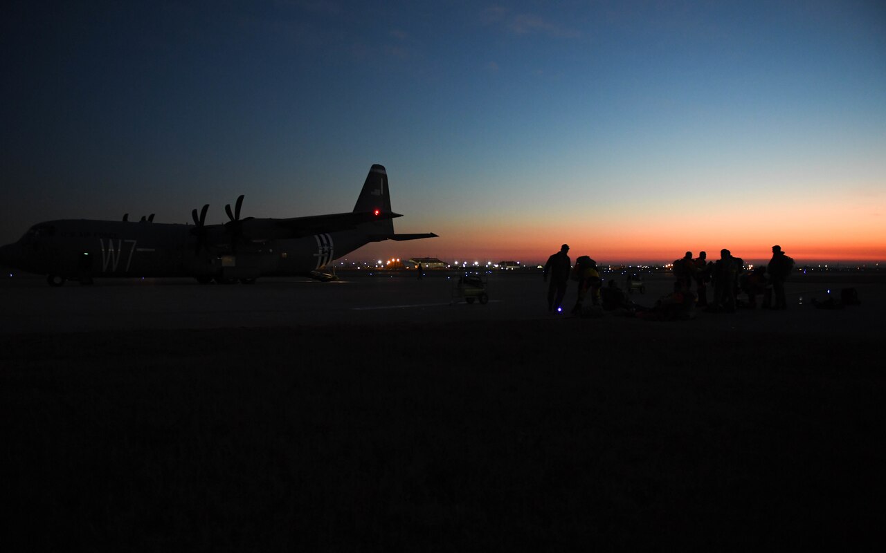 Airmen prepare to enter an aircraft.