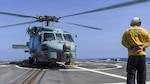 An MH-60R Seahawk Helicopter assigned to the "Scorpions" of Helicopter Maritime Strike Squadron (HSM) 49 prepares for take-off from the Arleigh Burke-class guided-missile destroyer USS Sampson (DDG 102) as the ship is positioned to conduct lifesaving actions in support of disaster relief efforts in Tonga. The Australian Government response is being coordinated closely with France and New Zealand under the FRANZ partnership; alongside Fiji, Japan, United Kingdom, and the United States, to assist Tonga in its time of need. Sampson is on a scheduled deployment in the U.S. 7th Fleet area of operations to enhance interoperability with alliances and partnerships while serving as a ready-response force in support of a free and open Indo-Pacific region.