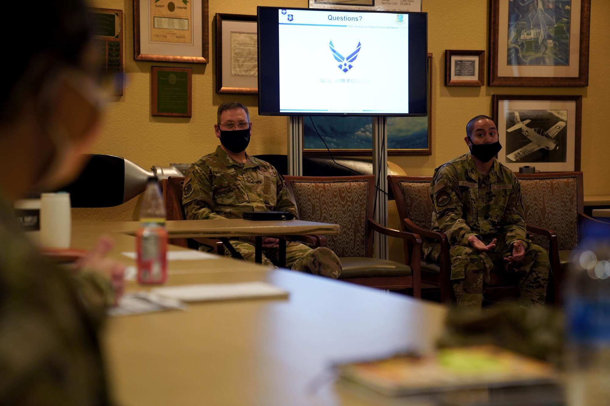 U.S. Air Force Col. James Kafer, 81st Training Wing vice commander, and Chief Master Sgt. Mark Paraoan, 334th Training Squadron senior enlisted leader, instruct a class of officers before the First Term Officer Course inside the Bay Breeze Event Center at Keesler Air Force Base, Mississippi, January 19, 2022. The FTOC was created to develop the job and leadership skillsets of first-term officers. (U.S. Air Force photo by Senior Airman Seth Haddix)