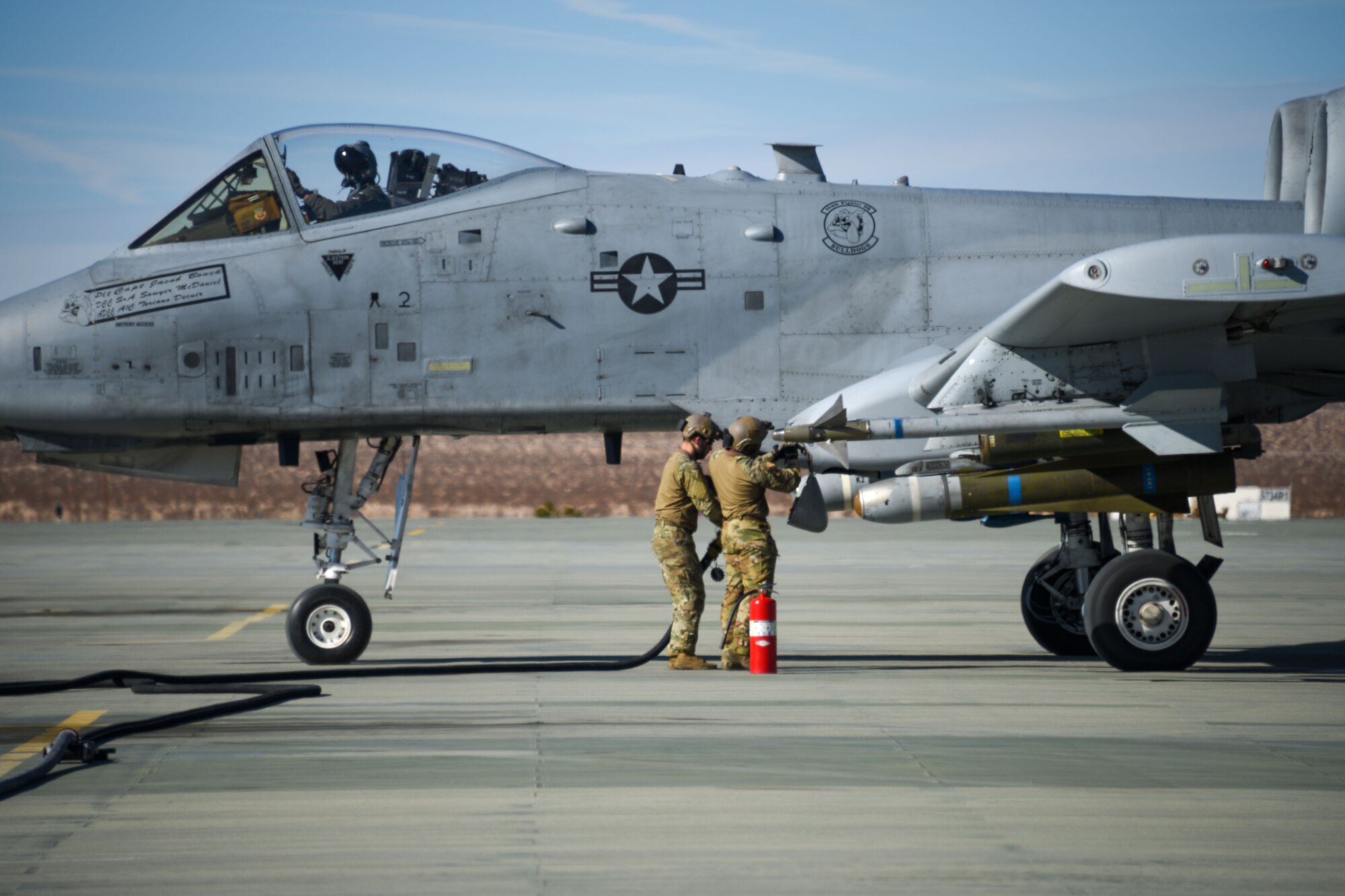 A photo of Airmen refueling an aircraft.