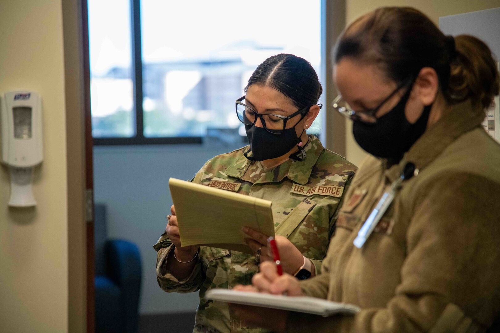 Members of the 559th Medical Squadron’s Mental Health Flight take notes during the MHS GENESIS “Go-Live” at Reid Health Services Center, Joint Base San Antonio-Lackland, Texas, Jan. 22, 2022. MHS GENESIS will become the standard electronic health record for Department of Defense and Veterans Affairs’ medical facilities.