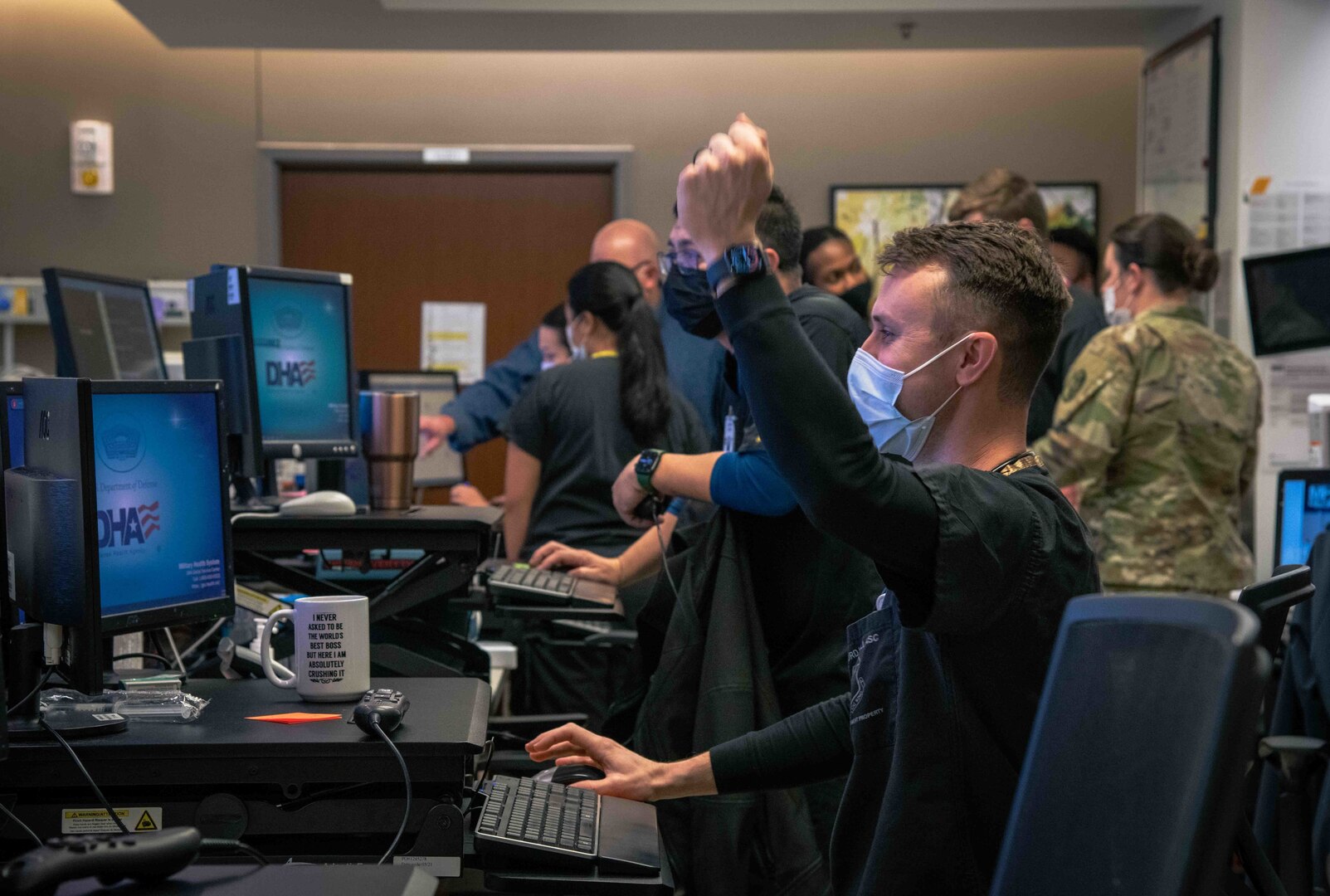 Maj. (Dr.) Andrew Gausepohl, Wilford Hall Ambulatory Surgical Center Family Emergency Center medical director, celebrates inputting his first prescription into the new MHS GENESIS system at the FEC, Joint Base San Antonio-Lackland, Texas, Jan. 22, 2022. The MHS GENESIS patient portal grants patients 24/7 access to their healthcare information.