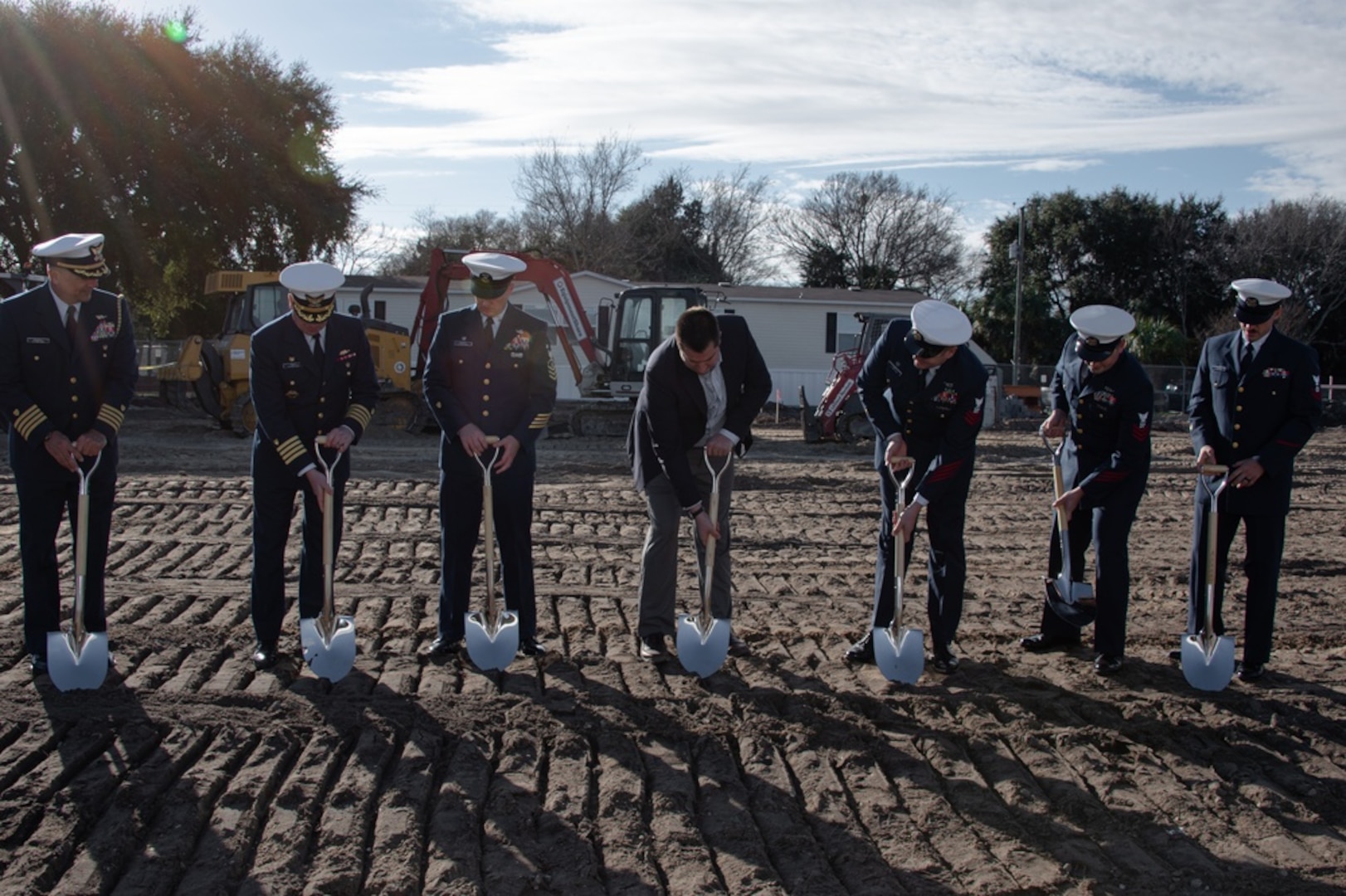 Coast Guard leadership from local units break ground for new construction during a groundbreaking ceremony at Coast Guard Station Tybee, Georgia, Jan. 12, 2022. The new building will be used for Station Tybee, Coast Guard Cutter Pompano, and Coast Guard Aids to Navigation Tybee Island to support their multiple missions. (U.S. Coast Guard photo by Petty Officer 1st Class David Micallef)