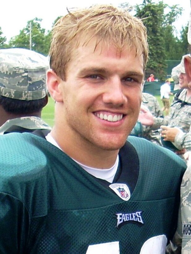 A football player smiles.
