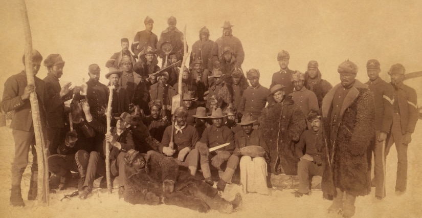 Soldiers pose for a group photo.