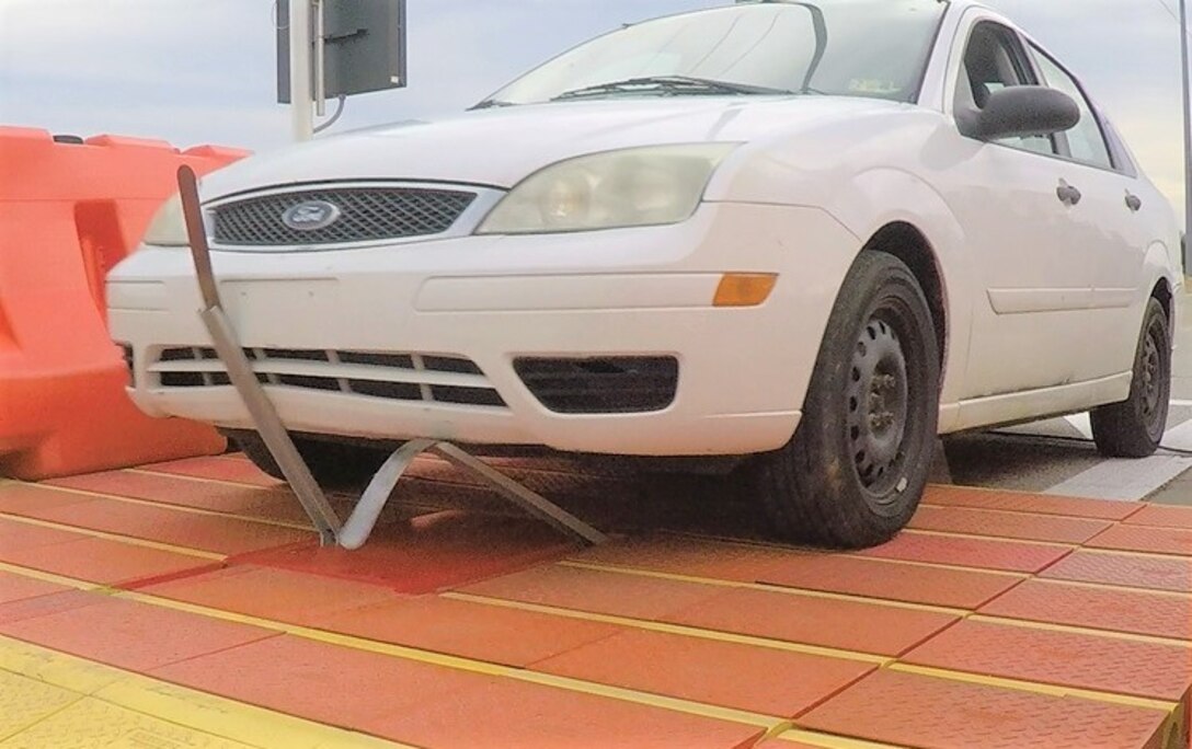 IMAGE: The Pre-emplaced Electric Vehicle Stopper (PEVS) system activates as an unauthorized vehicle passes over during the first installment phase at the Distinguished Visitors Demonstration at Tinker Air Force Base in Oklahoma in February 2019.