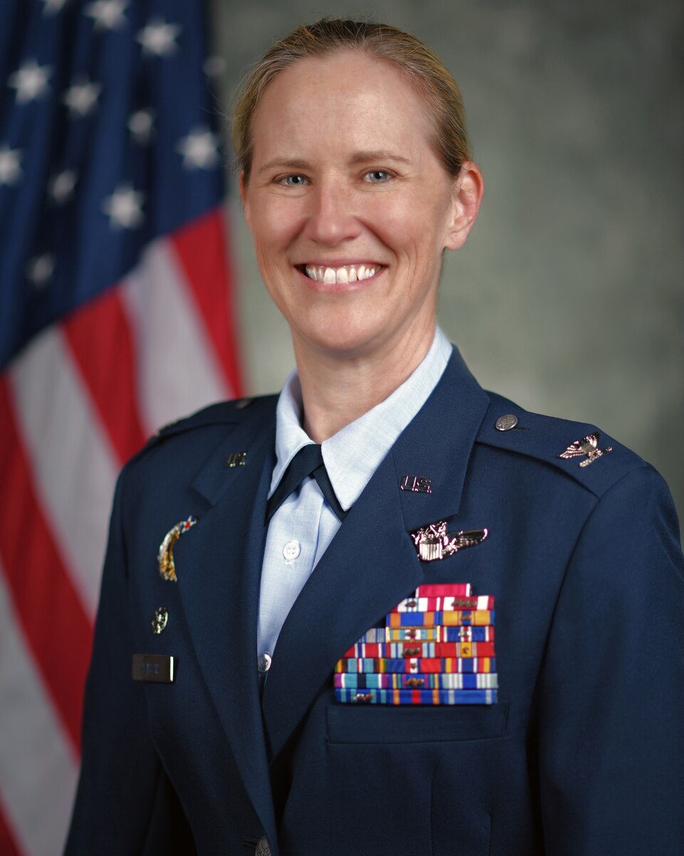 A standard U.S. Air Force biography head and shoulders photo of Col. Lisa Nemeth with an American flag behind the right shoulder.
