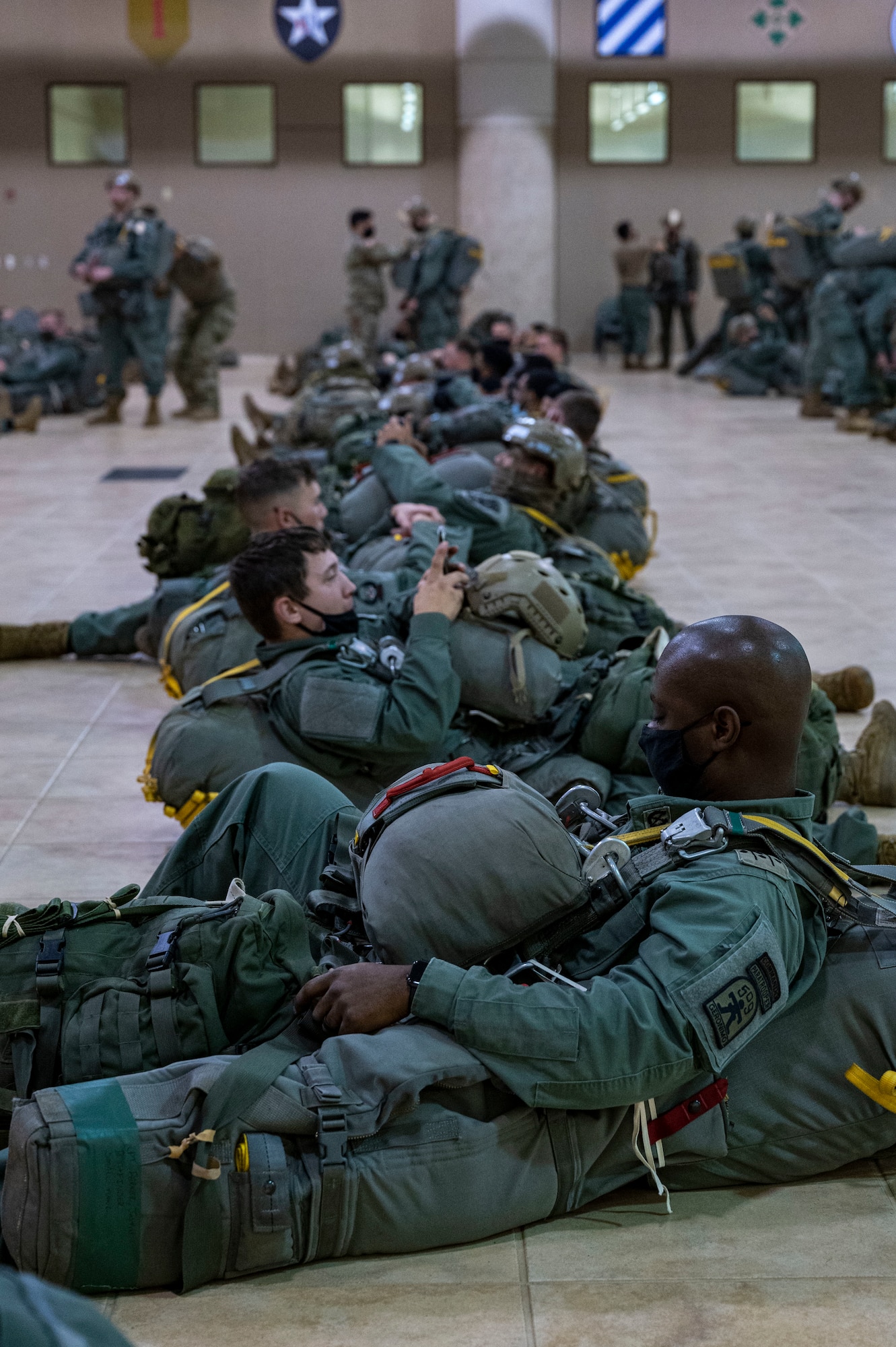 U.S. Army paratroopers with the 1st Battalion, 509th Infantry Regiment, prepare for a jump