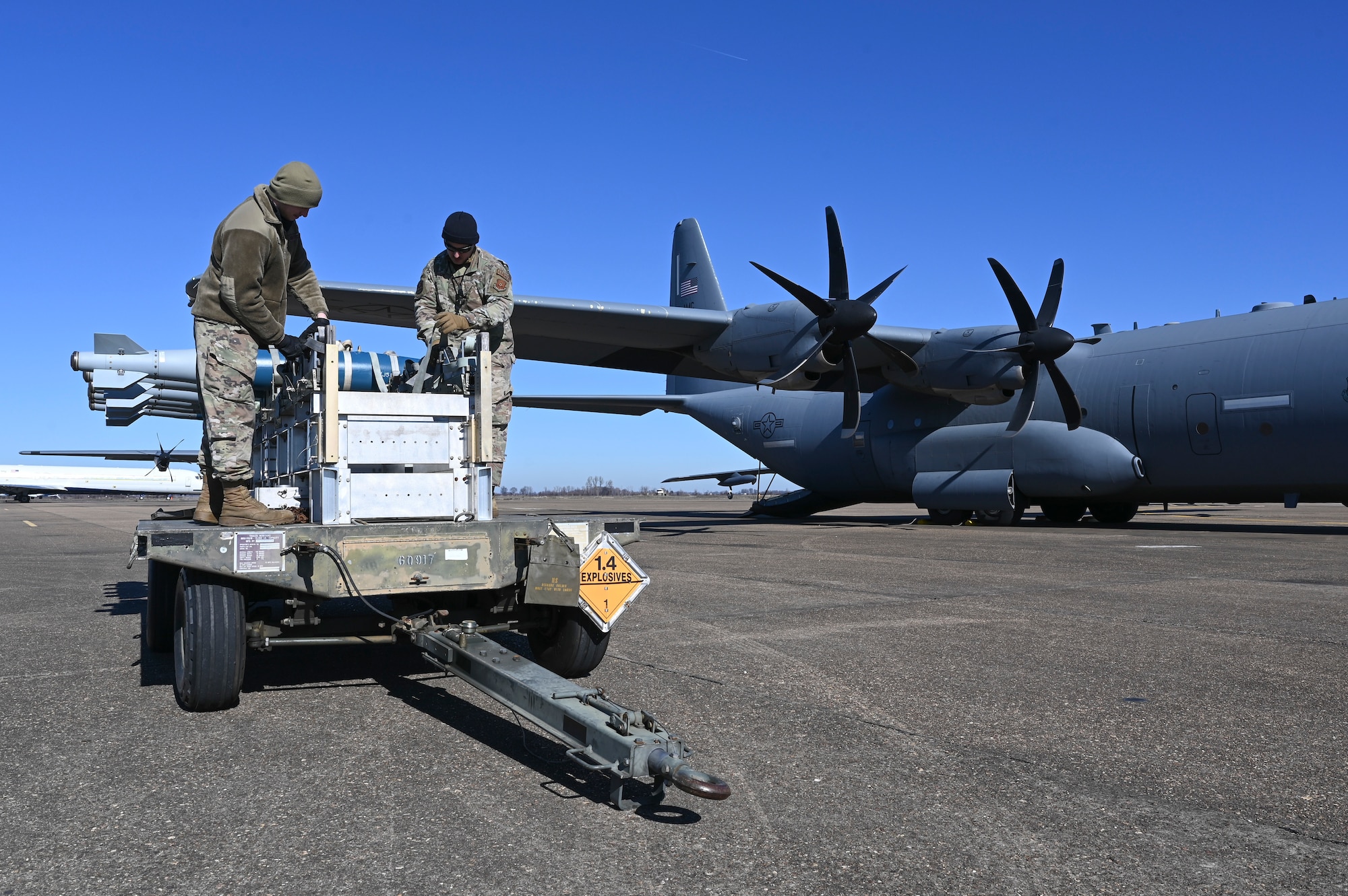 Airmen prepare munitions for transfer