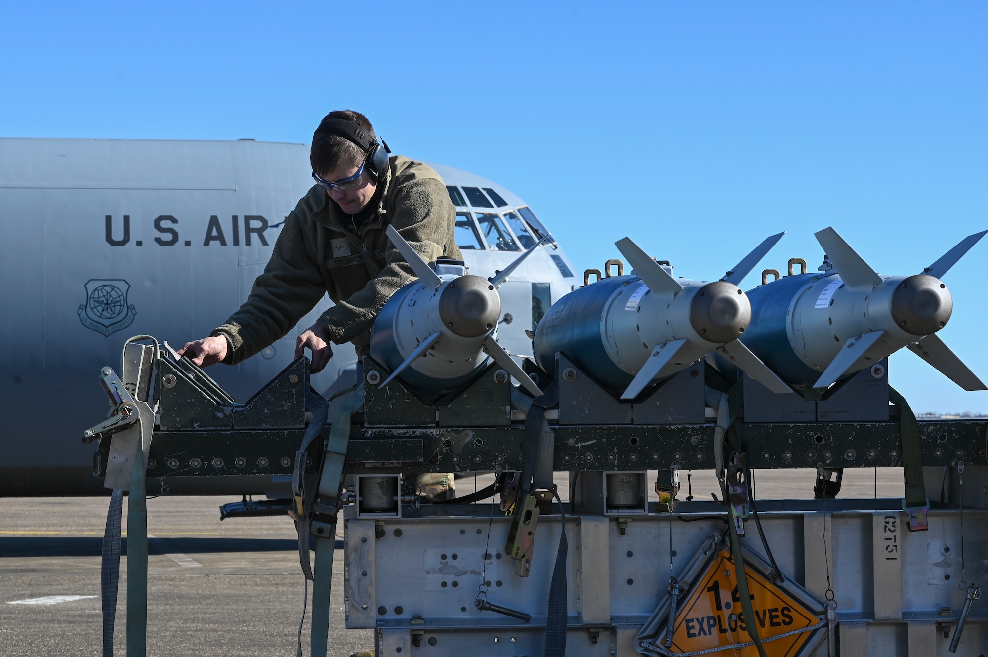An Airman prepares munitions for transfer