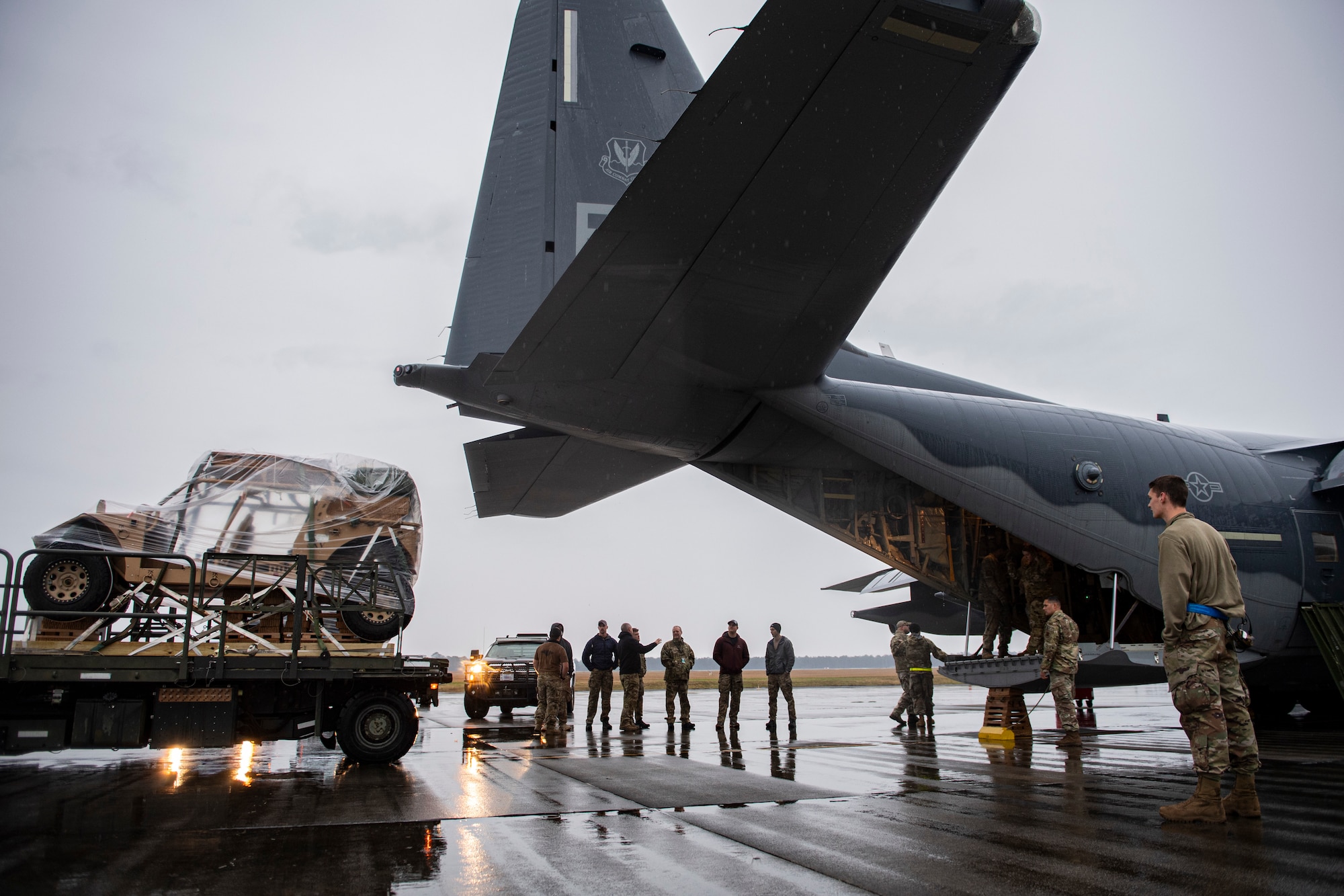 Photo of Airmen loading a vehicle onto an aircraft