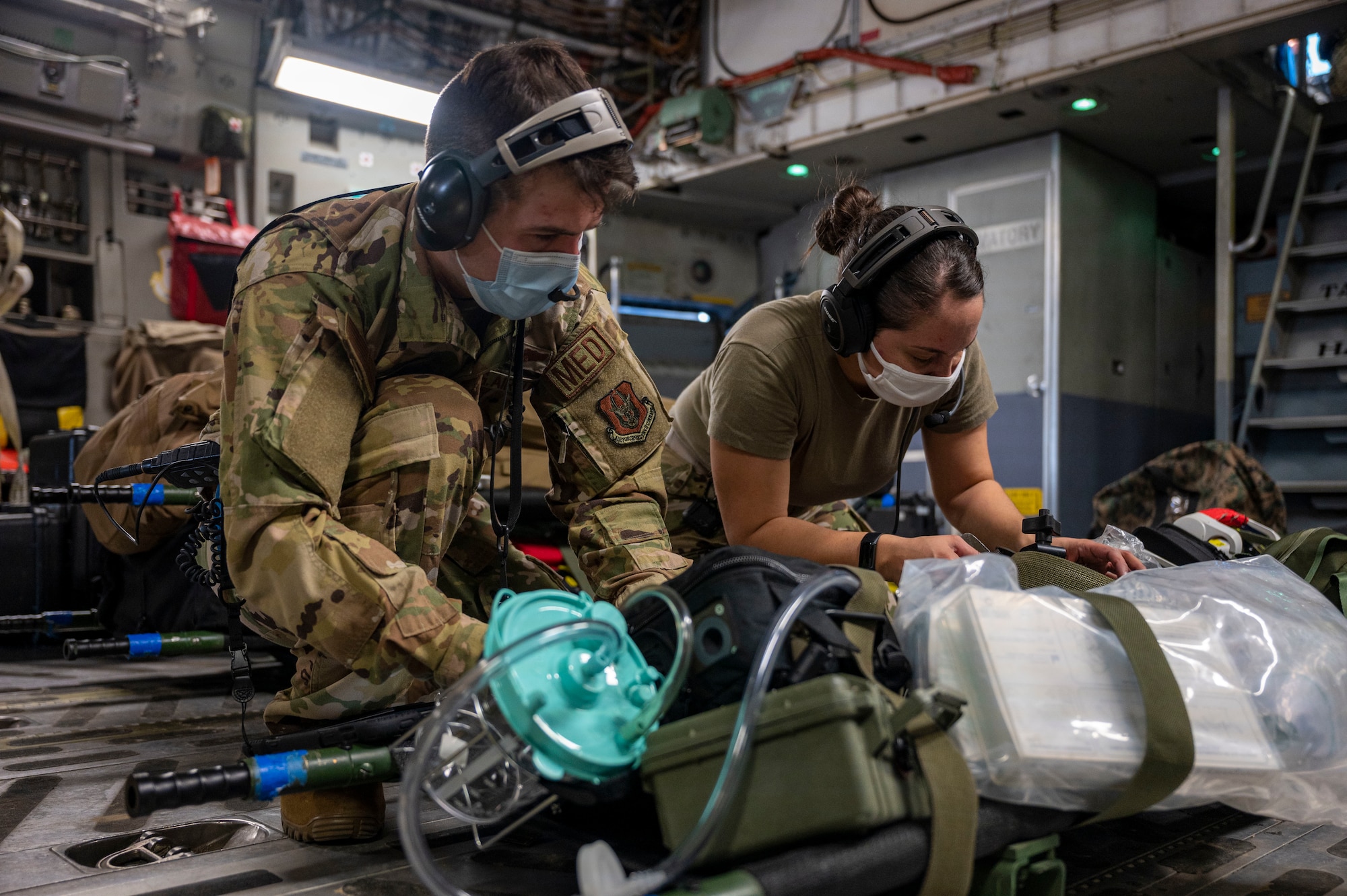 Technicians prepare a C-17 Globemaster III for simulated patients during an Aeromedical Evacuation exercise