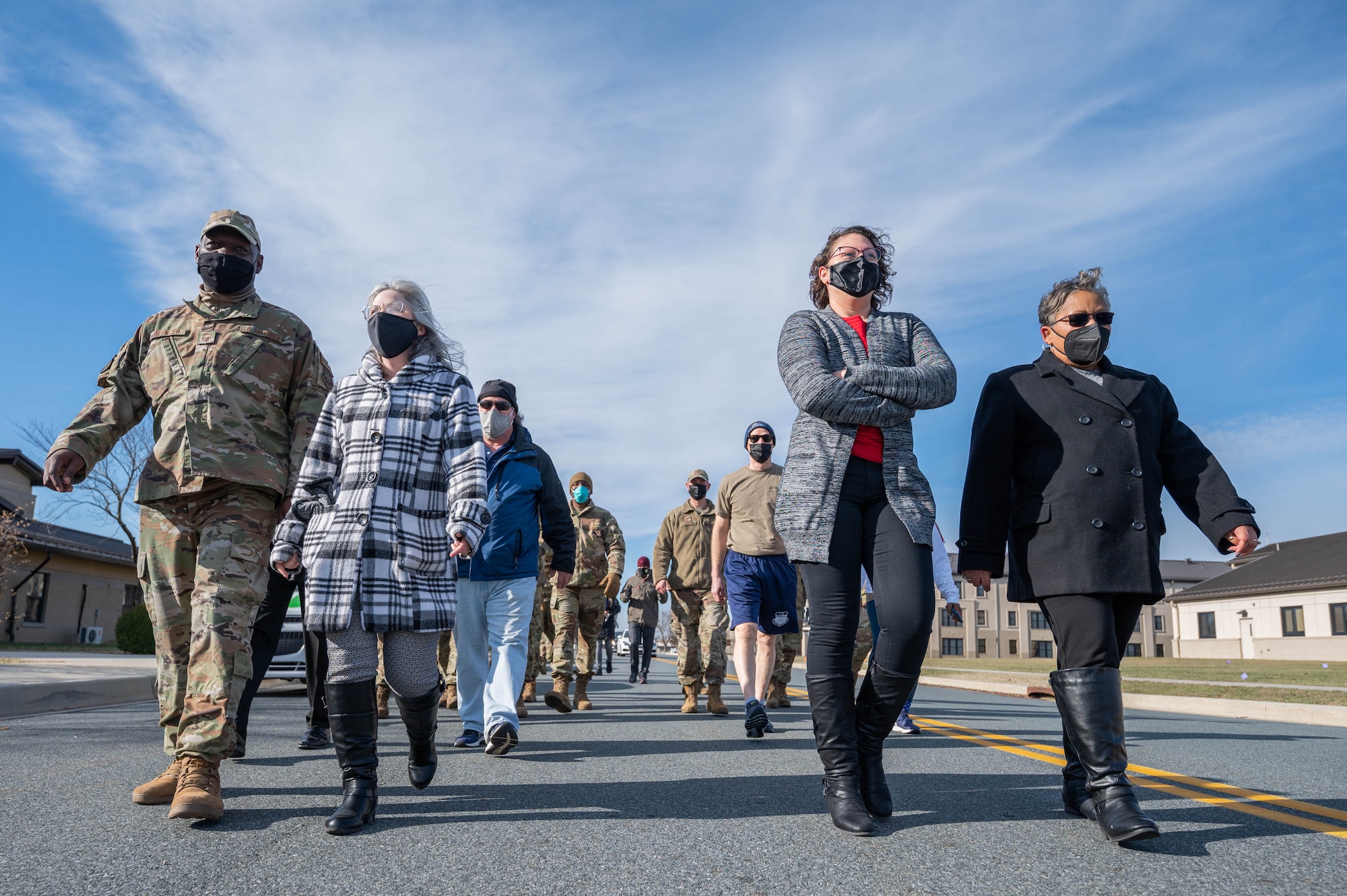 Members of Team Dover participate in the Martin Luther King Jr. Remembrance Day symbolic walk at Dover Air Force Base, Delaware, Jan. 19, 2022. The walk was organized by the African American Heritage Committee, the Dover Special Observances Committee and the 436th Airlift Wing Diversity and Inclusion Group. (U.S. Air Force photo by Mauricio Campino)
