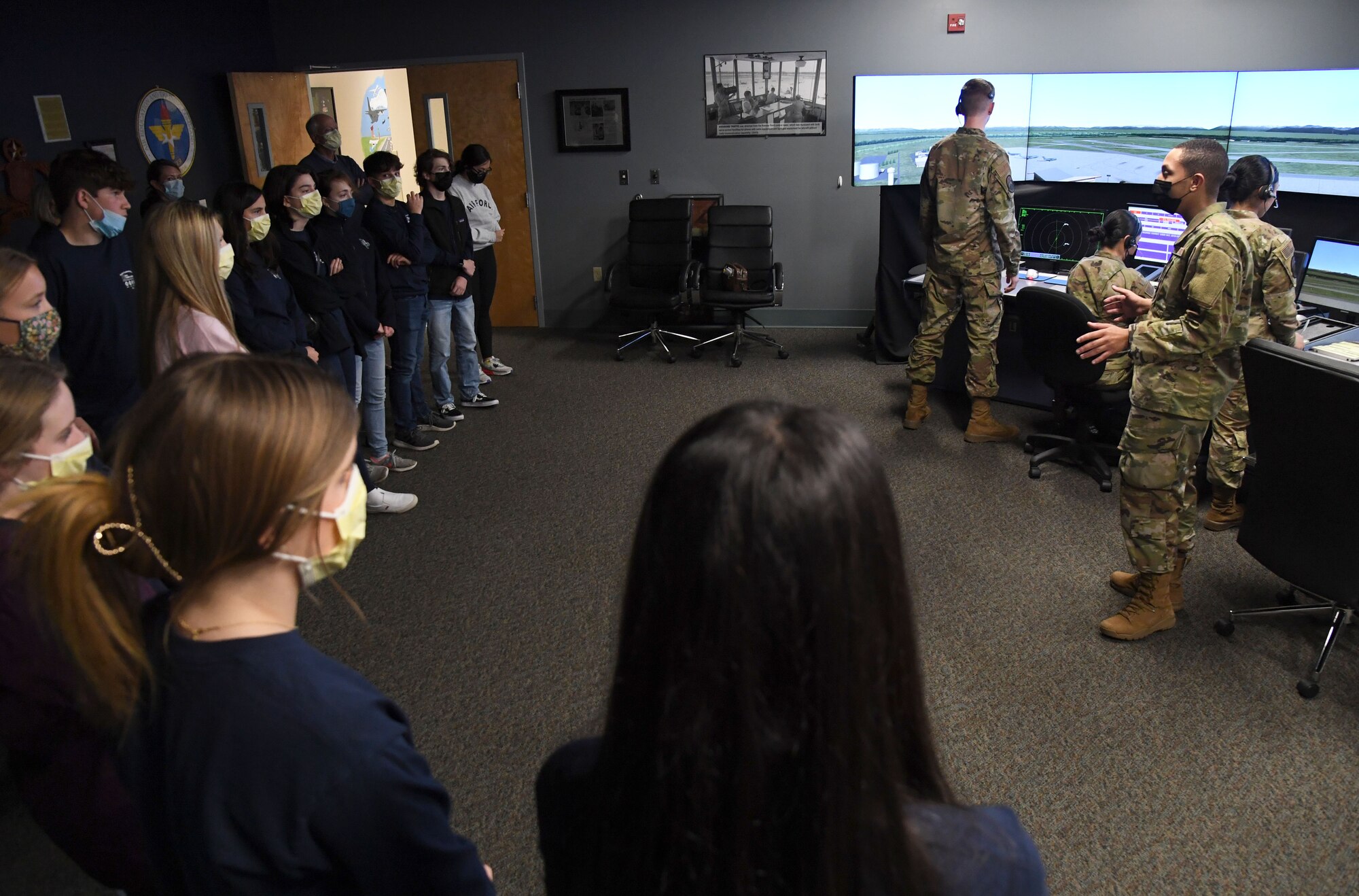 U.S. Air Force Airman 1st Class Sean Ware, 334th Training Squadron student, briefs air traffic control training procedures to high school students inside Cody Hall during a tour at Keesler Air Force Base, Mississippi, Jan. 25, 2022. Approximately 20 Freshmen from Biloxi High School and St. Patrick Catholic High School participated in the Biloxi Chamber of Commerce Junior Leadership Program whose purpose is to produce students of outstanding character who are more sensitive to the needs of the community and are better able to contribute to society. (U.S. Air Force photo by Kemberly Groue)