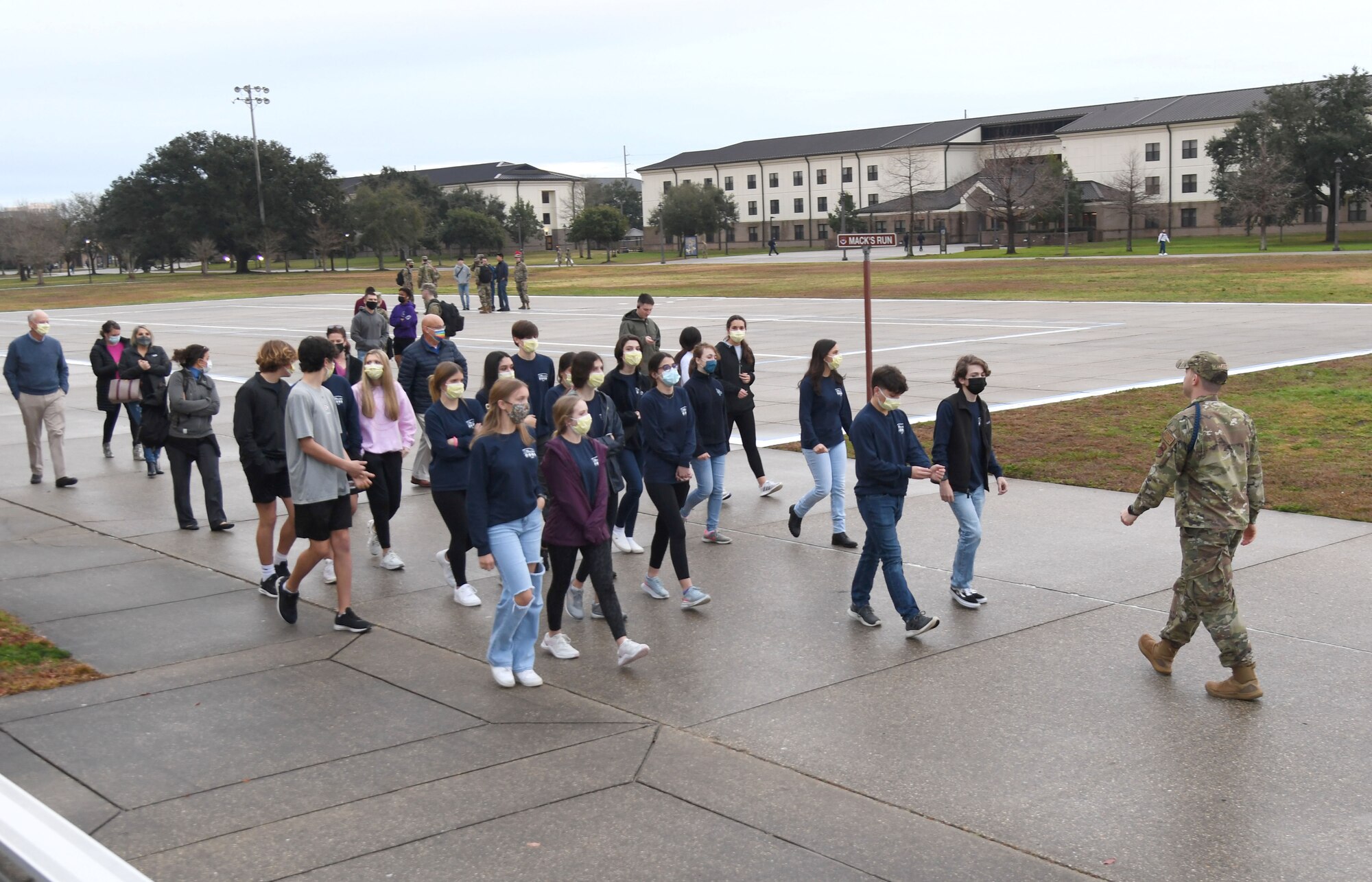 U.S. Air Force Staff Sgt. Russell Elliott, 336th Training Support Squadron military training leader, provides a tour of student dorms at Keesler Air Force Base, Mississippi, Jan. 25, 2022. Approximately 20 Freshmen from Biloxi High School and St. Patrick Catholic High School participated in the Biloxi Chamber of Commerce Junior Leadership Program whose purpose is to produce students of outstanding character who are more sensitive to the needs of the community and are better able to contribute to society. (U.S. Air Force photo by Kemberly Groue)