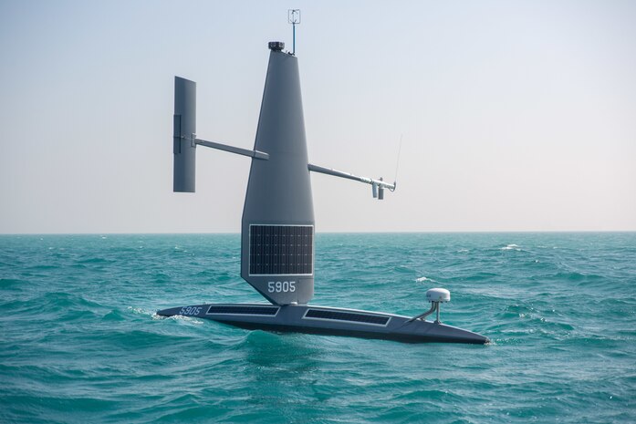220127-A-RM286-1816 ARABIAN GULF (Jan. 27, 2022) A Saildrone Explorer unmanned surface vessel (USV) is being towed out to sea in the Arabian Gulf off Bahrain’s coast, Jan. 27. U.S. Naval Forces Central Command began operationally testing the USV as part of an initiative to integrate new unmanned systems and artificial intelligence into U.S. 5th Fleet operations.