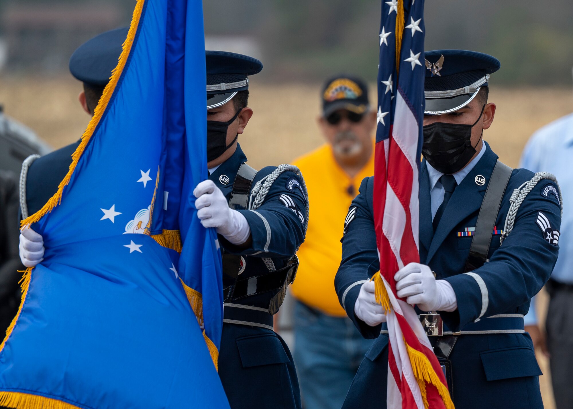 Honor guardsmen from Seymour Johnson Air Force Base position flags during a Wreaths Across America ceremony at Pikeville Cemetery in Pikeville, North Carolina, Dec. 19, 2021.