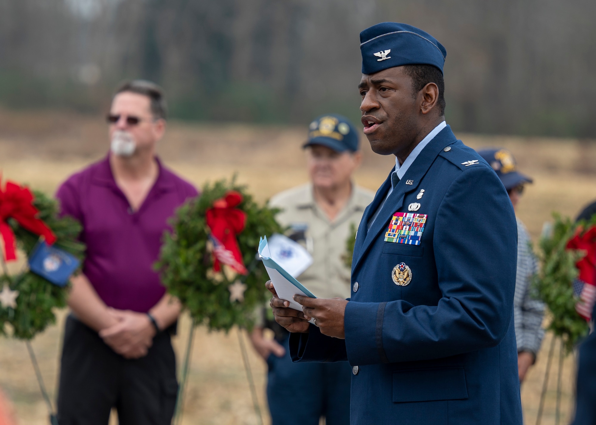 Col. Dolphis Hall, 4th Medical Group commander, speaks at a Wreaths Across America ceremony at the Pikeville Cemetery in Pikeville, North Carolina, Dec. 19, 2021.