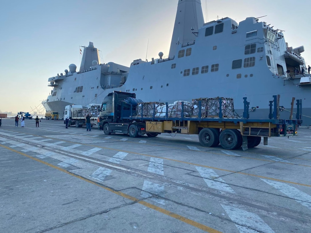 Duqm, Oman (Jan. 13, 2022) Naval Supply Systems Command (NAVSUP) Fleet Logistics Center (FLC) Bahrain (Oman detachment) supported USS Portland (LPD 27) during a port visit to Duqm, Oman, Jan. 4-15. While in port, the ship received provisions, spare parts, and over 8,000 pounds of mail. FLC Logistics Support Representatives (LSRs) from Bahrain and Oman coordinated the complex evolution with local officials and to ensure the cargo was delivered and assisted the ship with loading onboard. NAVSUP FLC Bahrain is one of eight FLCs under Commander, NAVSUP. Headquartered in Mechanicsburg, Penn., and employing a diverse, worldwide workforce of more than 22,500 military and civilian personnel, NAVSUP's mission is to provide supplies, services, and quality-of-life support to the Navy and joint warfighter. (U.S. Navy photo by Lieutenant Commander Emma Larenas)