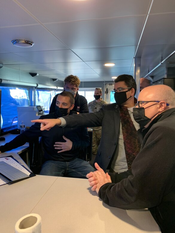 Nick Spina (left) of the USACE Philadelphia District demonstrates hydrographic survey technology to Mr. Michael Connor (middle right), the Assistant Secretary of the Army for Civil Works, during a Jan. 26, 2022 visit aboard the H.R. SPIES survey vessel.