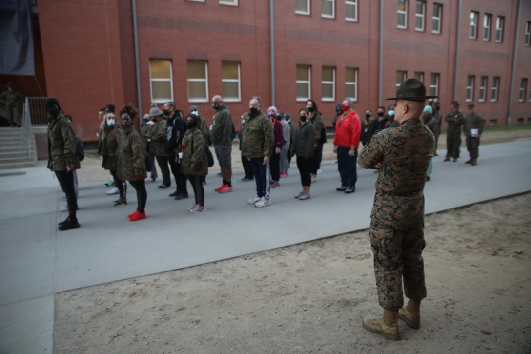 Educators from across Louisiana are being taught drill by Staff Sgt. Devin Kennett during an Educators Workshop aboard Marine Corps Recruit Depot Parris Island, S.C., Jan. 12, 2022. Marine Corps Recruiting Command provides educators workshops as an opportunity for teachers, principals, counselors, coaches and media to experience the basic training process first-hand. The workshops are one of many ways for the attendees to learn about the multitude of opportunities the Marine Corps can provide to young men and women within their communities.