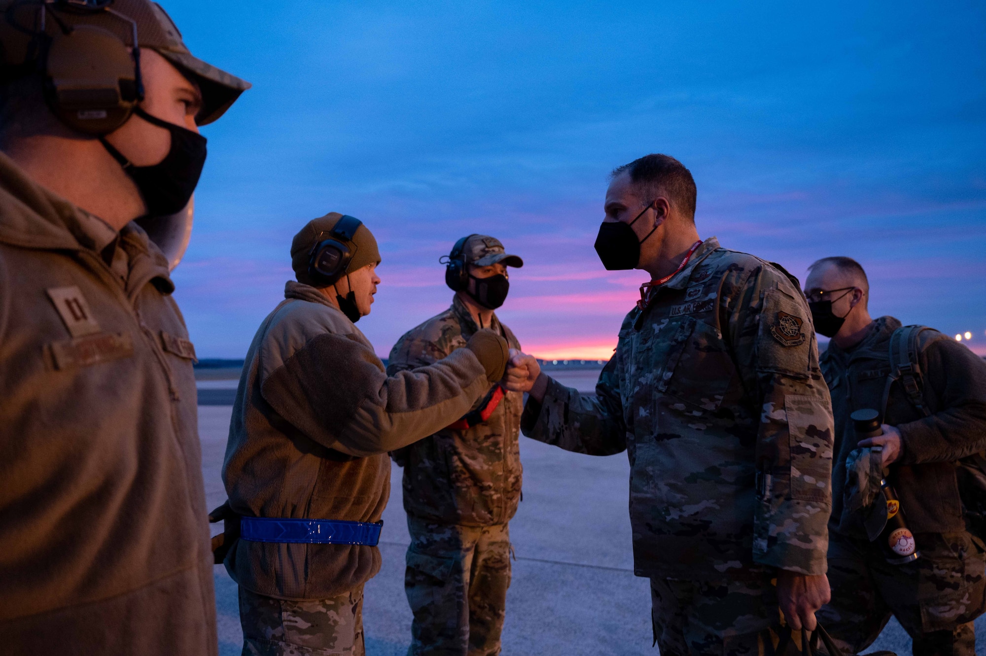 Col. Matt Husemann (center right), 436th Airlift Wing commander, greets Airmen from the 736th Aircraft Maintenance Squadron before a flight to Westover Air Reserve Base, Massachusetts, at Dover Air Force Base, Delaware, Jan. 25, 2022. During the visit, Husemann and Chief Master Sgt. Tim Bayes, 436th AW command chief, toured the C-5 Isochronal Maintenance Dock and gave an all call to members of the 436th Maintenance Squadron, Operating Location Alpha, a tenant unit of the 436th AW. (U.S. Air Force photo by Senior Airman Faith Schaefer)