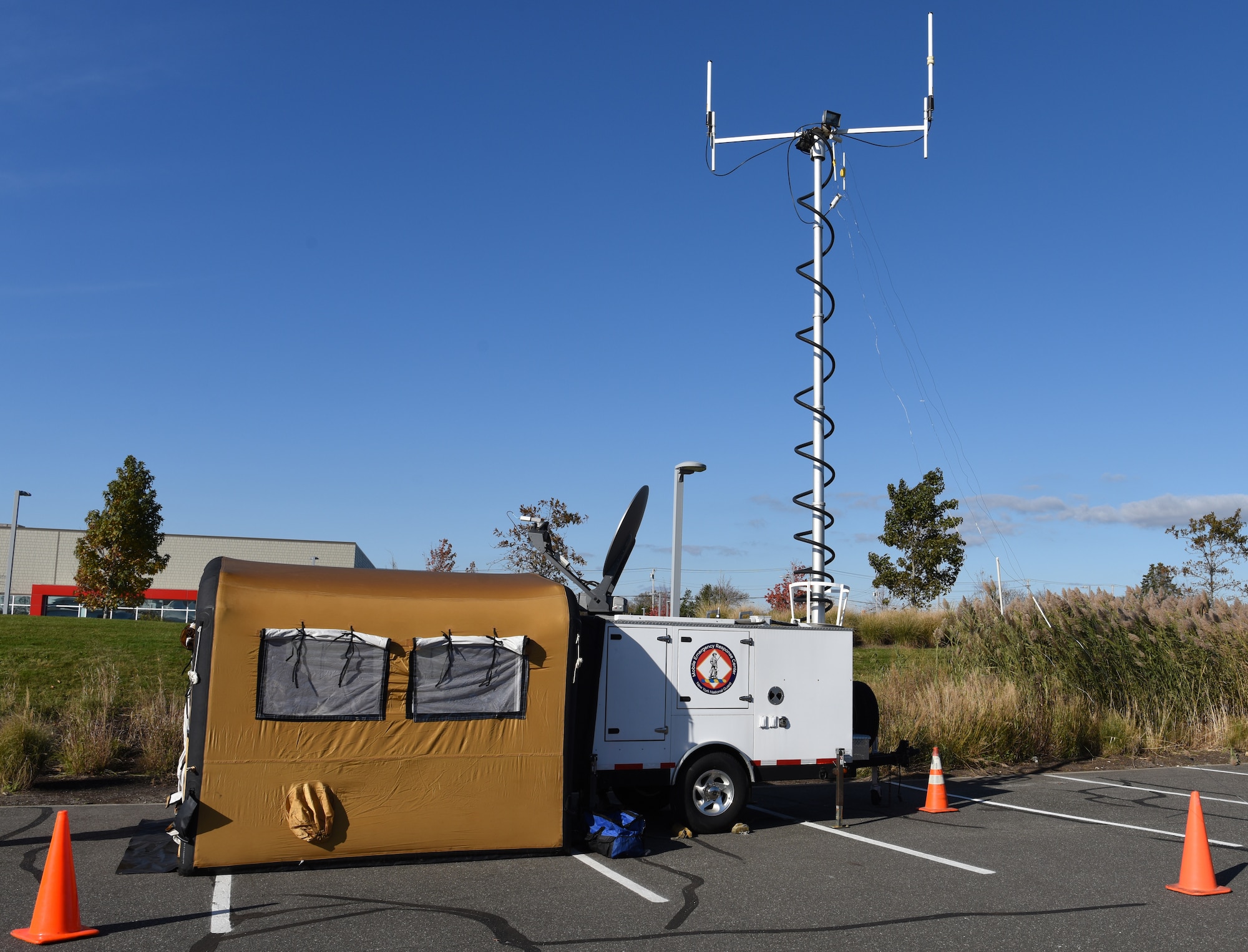 A fully deployed Mobile Emergency Response Center (MERC) at Westhampton Beach, N.Y., Nov. 6, 2021. The MERC allows disaster responders to establish reliable broadcast and reception in areas where communication infrastructure has been damaged. (U.S. Air National Guard photo by Staff Sgt. Sean Madden)