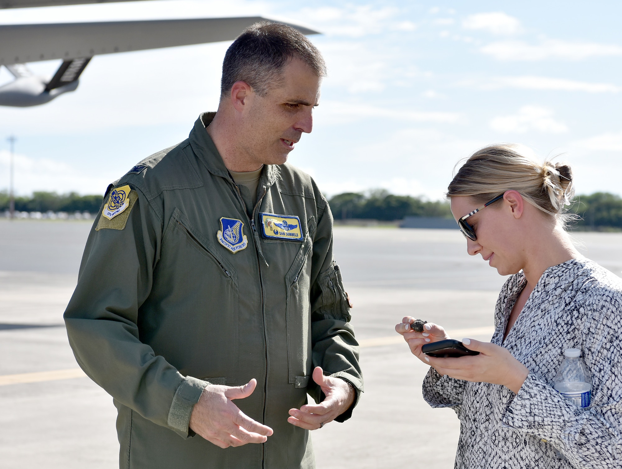 U.S. Air Force Col. Daniel Dobbels, 15th Wing commander, discusses the impact that Foreign Object Debris on the runway can have on an aircraft with Mrs. Kellie Hartl, U.S. military legislative assistant for Rep. David Valadao during their visit to Joint Base Pearl Harbor-Hickam, Hawaii, Jan. 25, 2022. Members of the 15th Wing hosted U.S. staff delegation members of the House Appropriations Committee and discussed the role the 15th Wing has in ensuring a free and open Indo-Pacific.  (U.S. Air Force photo by Tech. Sgt. Anthony Nelson Jr.)