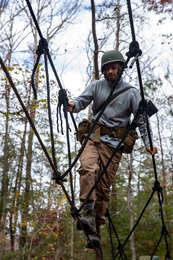 Students with the Wharton School of Business in Philadelphia, Pennsylvania complete leadership building challenges at Officer Candidate School on Marine Corps Base Quantico, Virginia, Dec. 3, 2021. This event is held to teach the students the importance of leadership and teamwork, even when faced with adversity. (U.S. Marine Corps Photo by Lance Cpl. George Nudo)