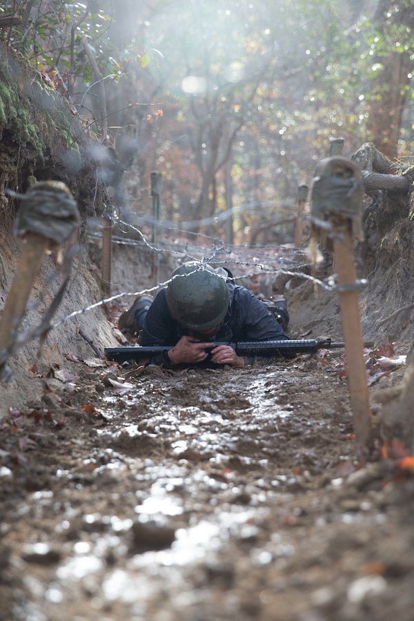 Students with the Wharton School of Business in Philadelphia, Pennsylvania complete leadership building challenges at Officer Candidate School on Marine Corps Base Quantico, Virginia, Dec. 3, 2021. This event is held to teach the students the importance of leadership and teamwork, even when faced with adversity. (U.S. Marine Corps Photo by Lance Cpl. George Nudo)