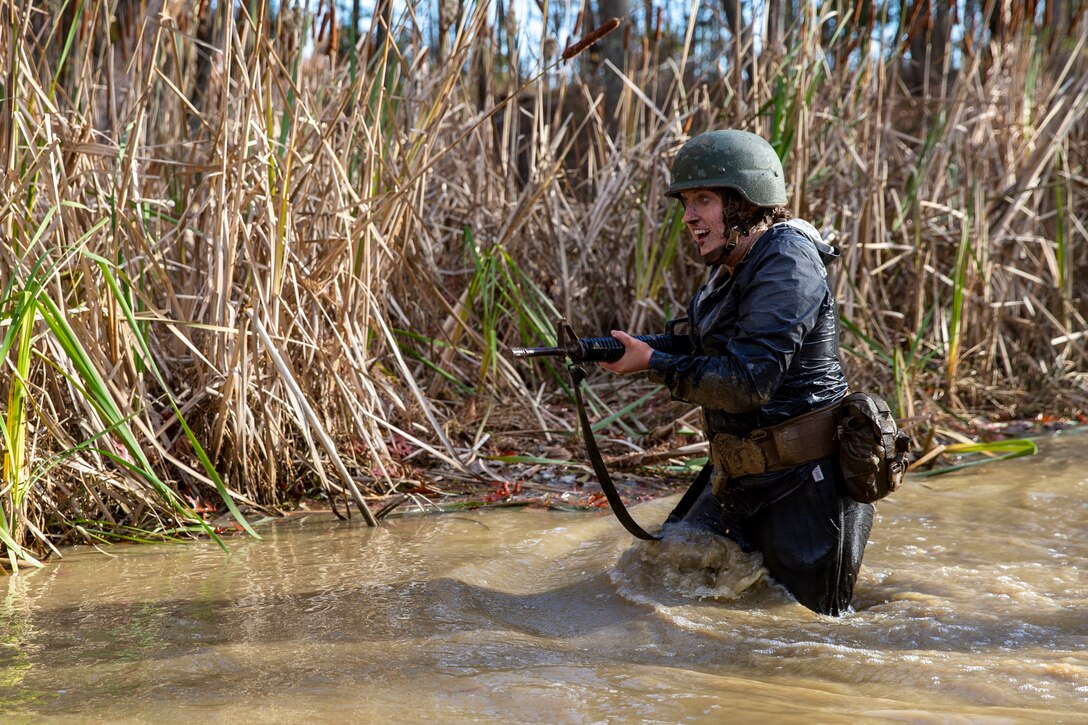 Students with the Wharton School of Business in Philadelphia, Pennsylvania complete leadership building challenges at Officer Candidate School on Marine Corps Base Quantico, Virginia, Dec. 3, 2021. This event is held to teach the students the importance of leadership and teamwork, even when faced with adversity. (U.S. Marine Corps Photo by Lance Cpl. George Nudo)