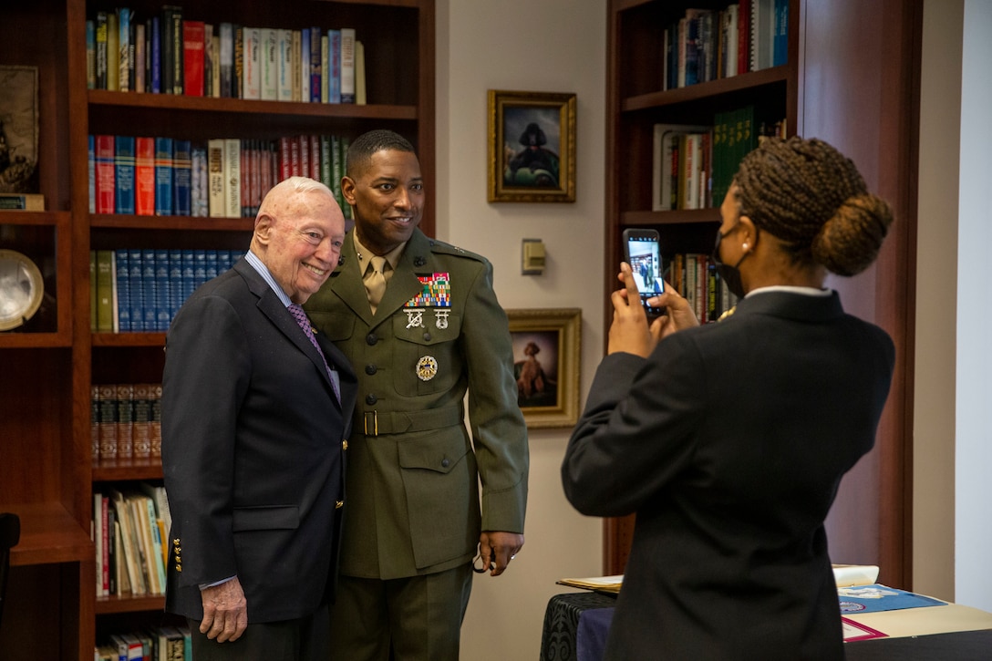 Retired U.S. Marine Corps General Alford M. Gray, 29th Commandant of the Marine Corps, and U.S. Marine Corps Brig. Gen. Ahmed T. Williamson, director, Manpower Plans and Policy Division pose for a photo after the General Alfred and Jan Gray Study Room ribbon cutting ceremony at Gray Research Center, Virginia, January 15, 2022. The study, display a wide range of books and extensive collection of personal items from the 29th Commandant, General Alfred M. Gray. This study was opened to support study and teaching at all levels within the Marine Corps through the storage of, organization of, and provision of access to tactical, operational, and strategic warfighting and international relations information. (U.S. Marine Corps photo by Cpl. Eric Huynh)