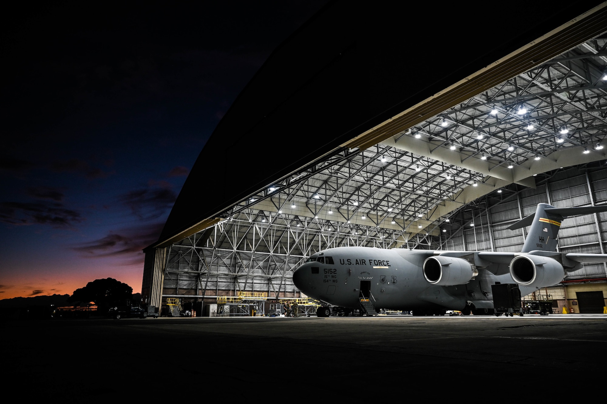 A C-17 Globemaster III sits in Hangar 34 at Joint Base Pearl Habor-Hickam, Hawaii, Jan. 25, 2022. The cargo aircraft is assigned to the 535th Airlift Squadron, which performs over 3,200 flight hours a year to support a free and open Indo-Pacific. (U.S. Air Force photo by Staff Sgt. Alan Ricker)