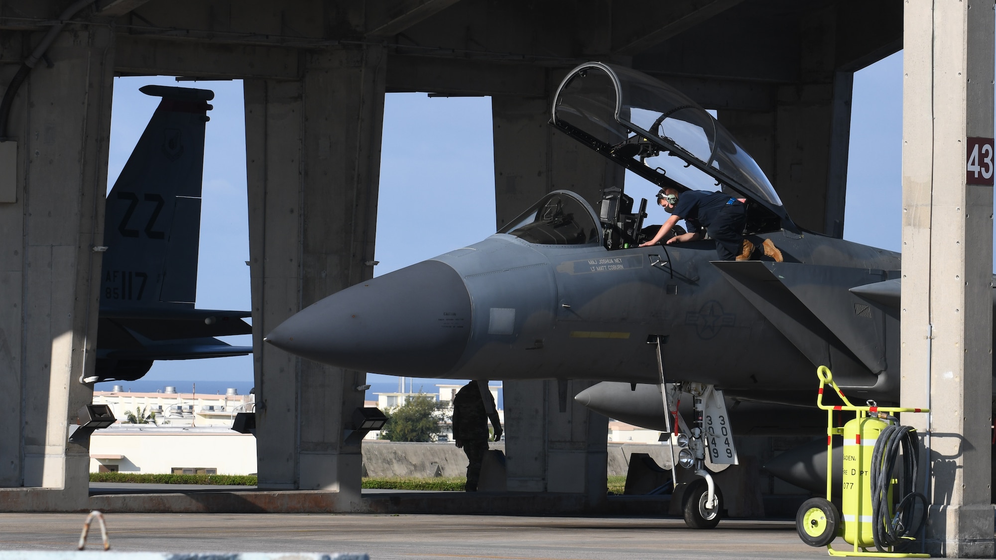 U.S. Air Force maintainers perform pre-flight checks on an F-15C Eagle