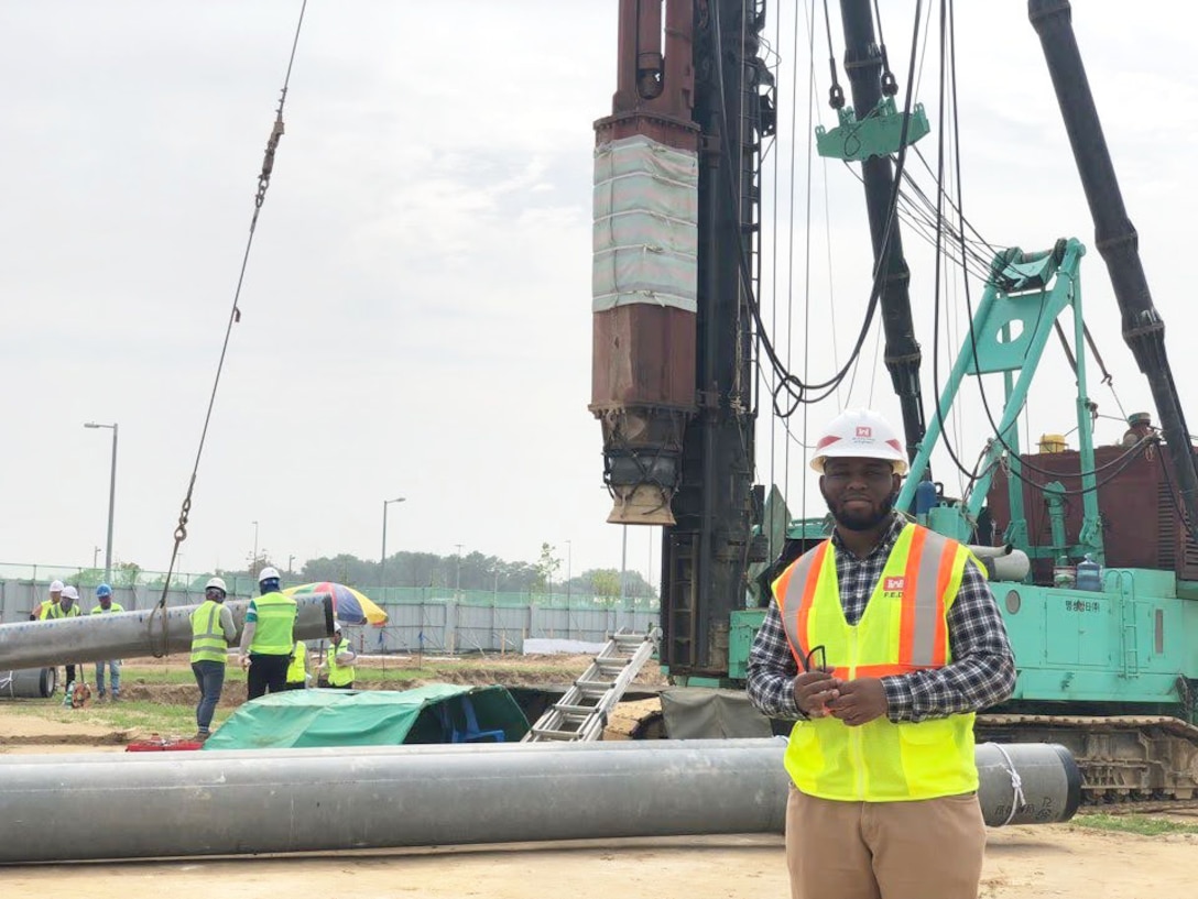 Samuel Coleman, Far East District intern, witnesses pile driving with pile driver machinery at an FED construction site, June 2019. FED recruitment efforts for the 2022 summer internships are starting in February. (Courtesy photo)