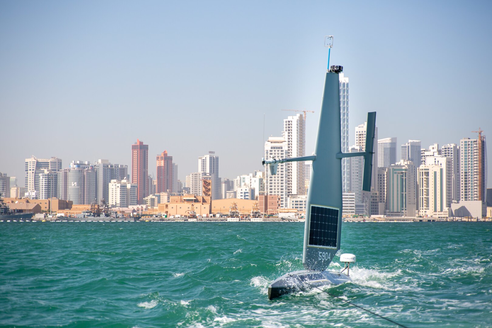 220127-A-RM286-2035 ARABIAN GULF (Jan. 27, 2022) A Saildrone Explorer unmanned surface vessel (USV) sails in the Arabian Gulf off Bahrain’s coast, Jan. 27. U.S. Naval Forces Central Command began operationally testing the USV as part of an initiative to integrate new unmanned systems and artificial intelligence into U.S. 5th Fleet operations.