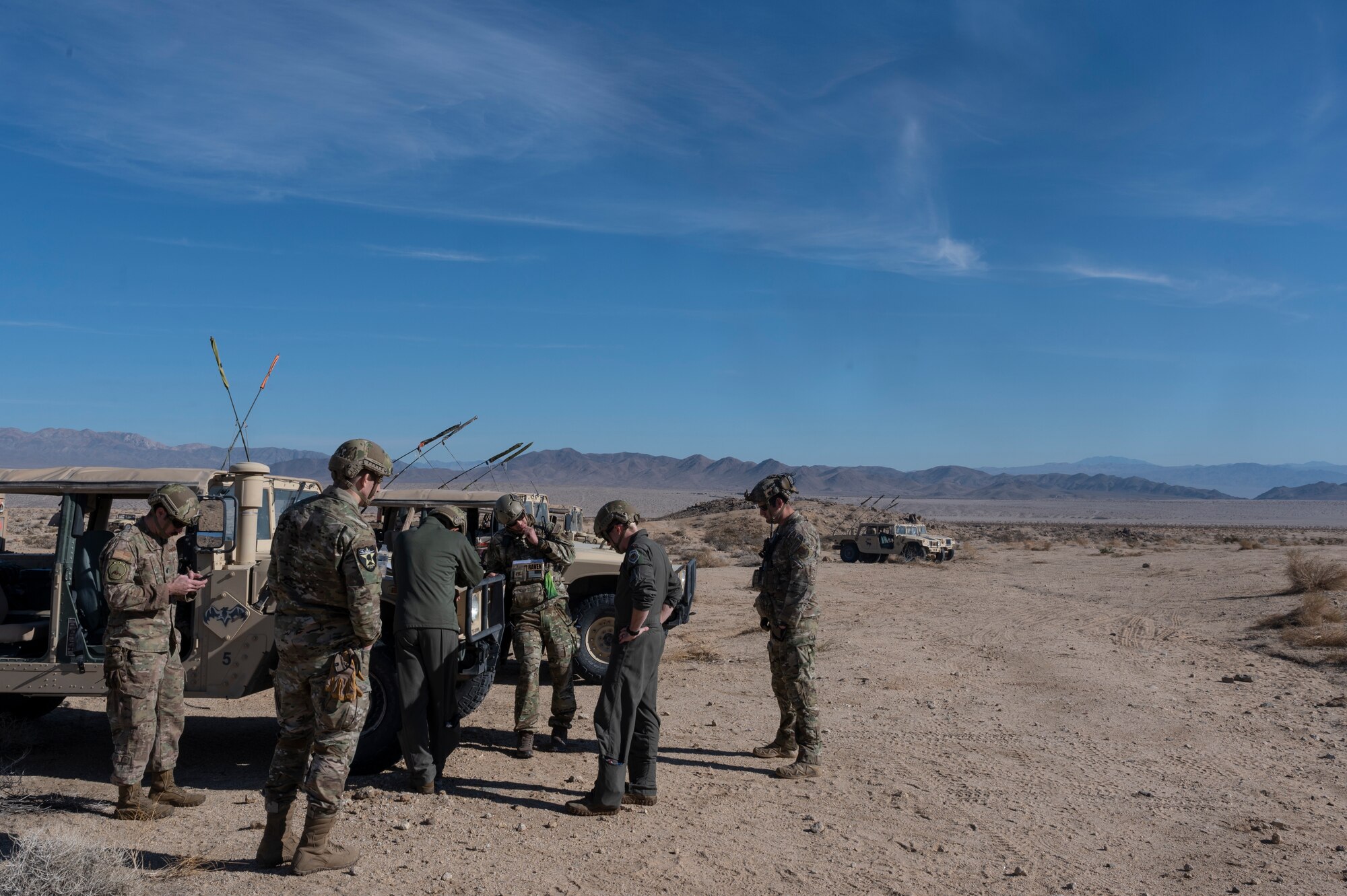 People standing next to a vehicle