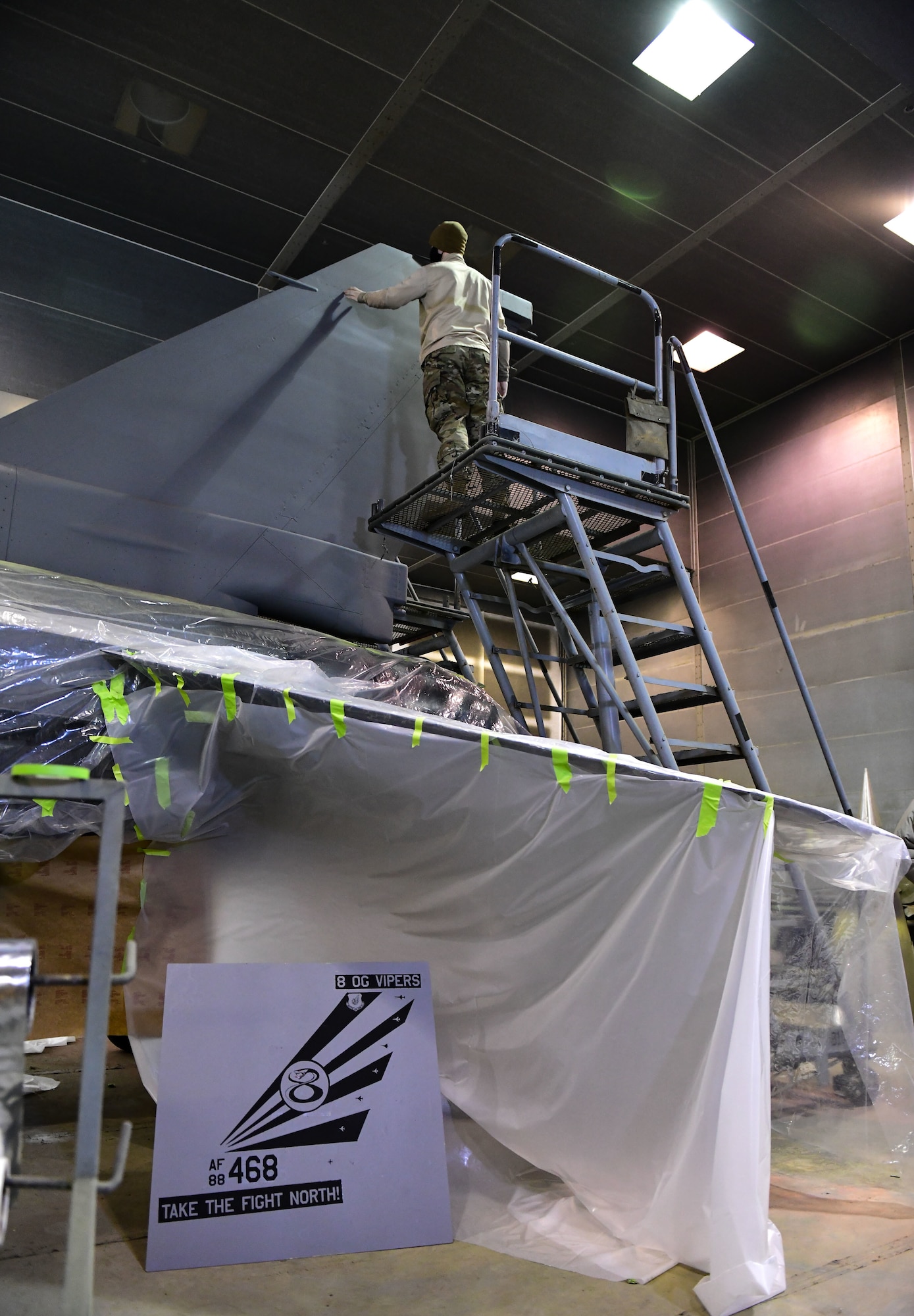 Staff Sgt. Alex Dixon, 8th Maintenance Squadron aircraft structural maintenance journeyman, examines the tail fin of an F-16 Fighting Falcon