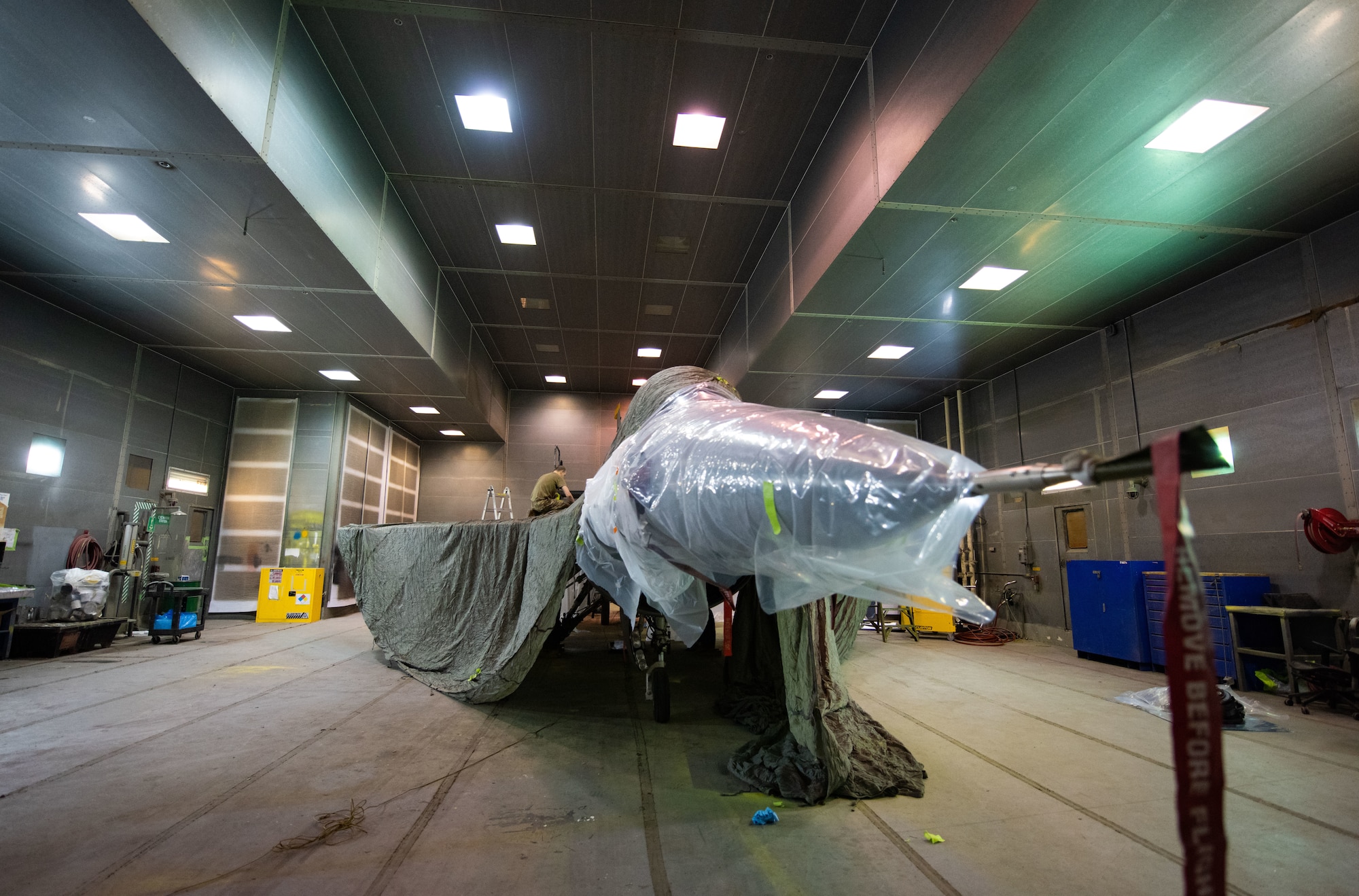 An F-16 Fighting Falcon is prepared to be painted