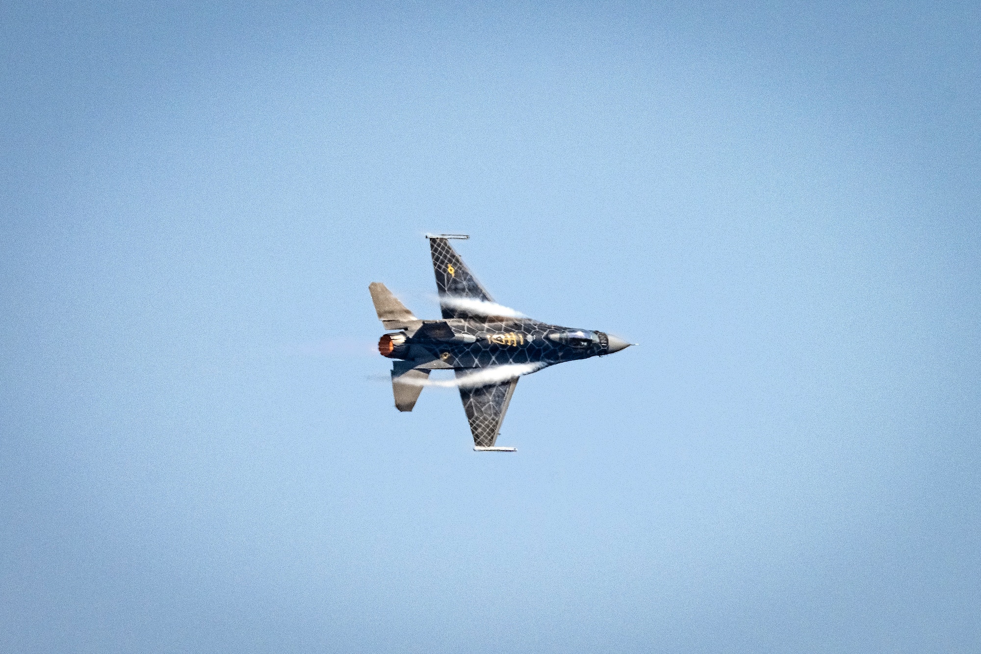 A pilot assigned to the F-16 Viper Demonstration Team performs a practice demo at Shaw Air Force Base, S.C., Jan. 26, 2022. The Team works closely with the Air Force Heritage Flight Foundation to create a unique demonstration for the U.S. Air Force past and present, exhibiting the professional qualities the Air Force develops in the people who fly, maintain and support these aircraft. (U.S. Air Force photo by Senior Airman Madeline Herzog)