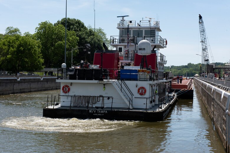 The Motor Vessel Tampa out of Ashland, Kentucky guides Marathon Petroleum Company fuel barges out of Cheatham Lock May 21, 2021, in Ashland City, Tennessee, headed to terminals in Nashville on the Cumberland River. The U.S. Army Corps of Engineers Nashville District worked with the fuel industry and Regional Rivers Repair Fleet to schedule openings to accommodate deliveries of fuel to Middle Tennessee. Each barge carries around 28,000 barrels of fuel. (USACE Photo by Lee Roberts)