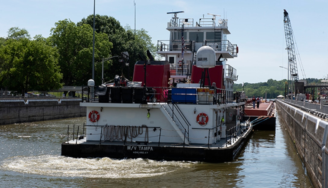 The Motor Vessel Tampa out of Ashland, Kentucky guides Marathon Petroleum Company fuel barges out of Cheatham Lock May 21, 2021, in Ashland City, Tennessee, headed to terminals in Nashville on the Cumberland River. The U.S. Army Corps of Engineers Nashville District worked with the fuel industry and Regional Rivers Repair Fleet to schedule openings to accommodate deliveries of fuel to Middle Tennessee. Each barge carries around 28,000 barrels of fuel. (USACE Photo by Lee Roberts)