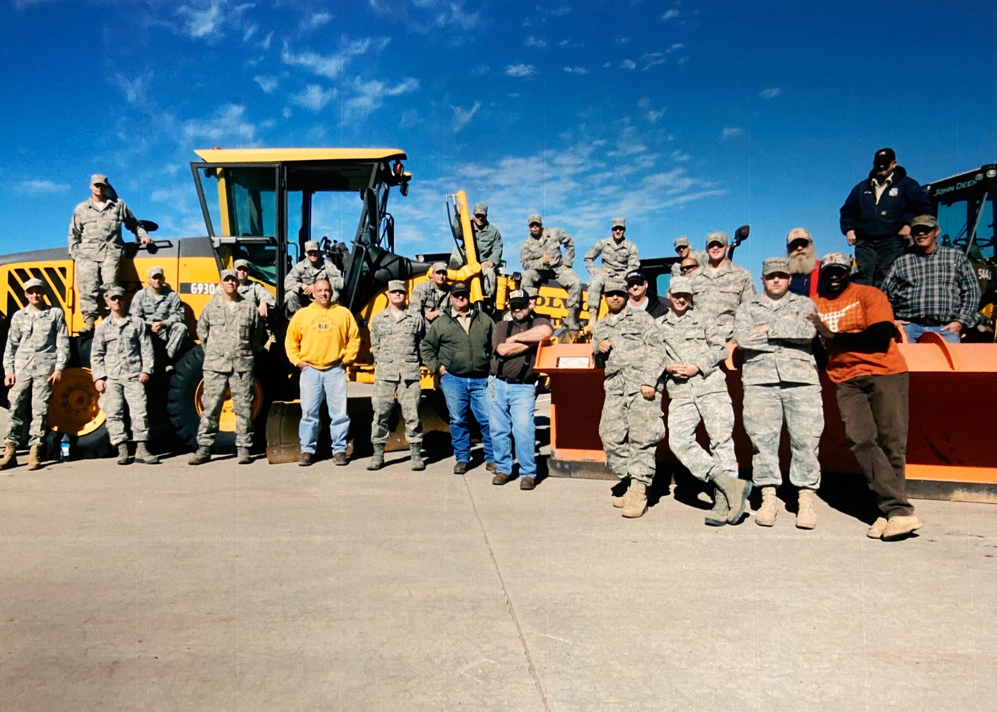group photo with heavy equipment front end loader
