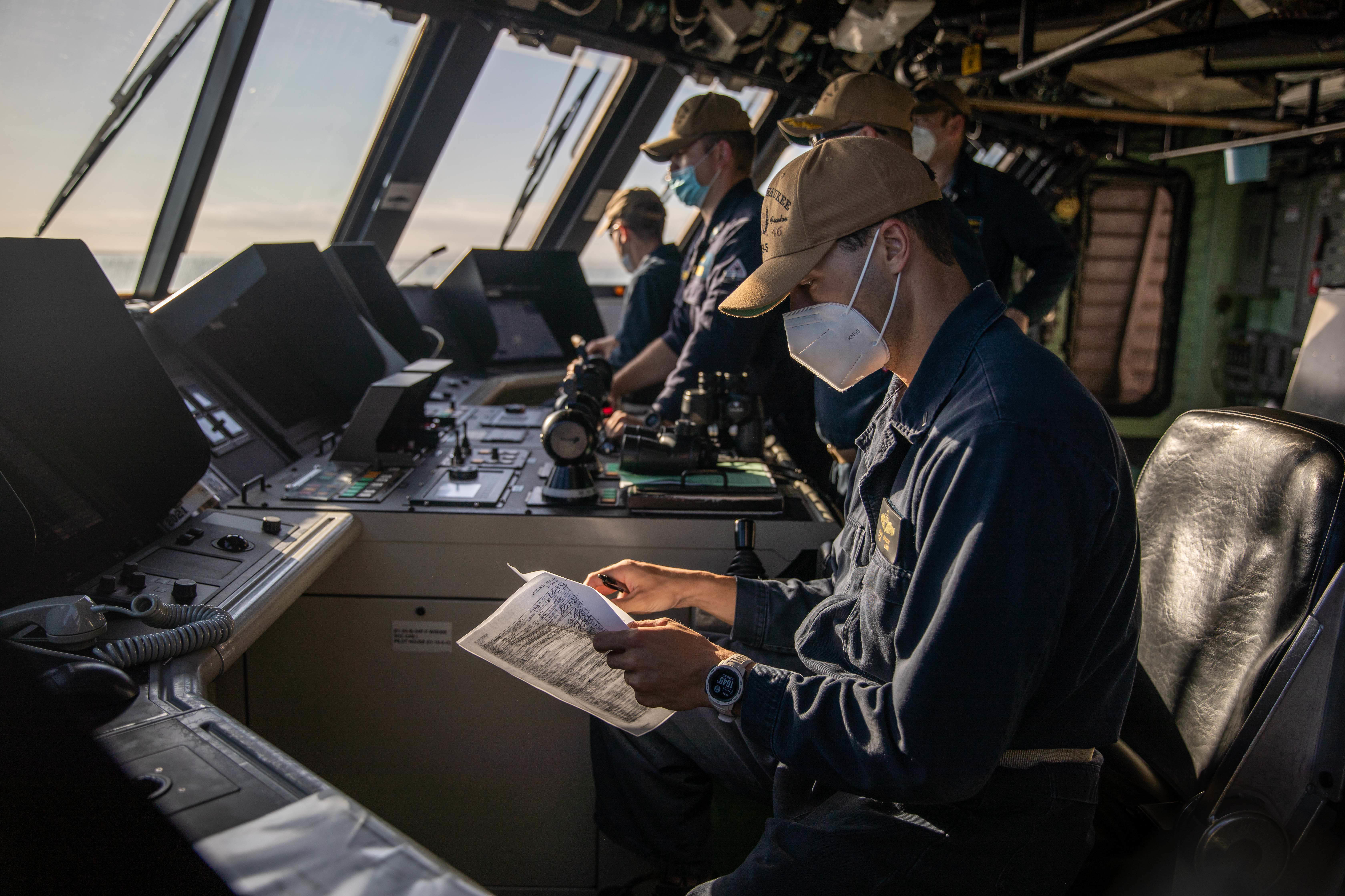 Lt. j.g. Colin Brady stands watch during sea and anchor detail in the pilot house of the Freedom-variant littoral combat ship USS Milwaukee (LCS 5) as the ship departs Ponce, Puerto Rico.