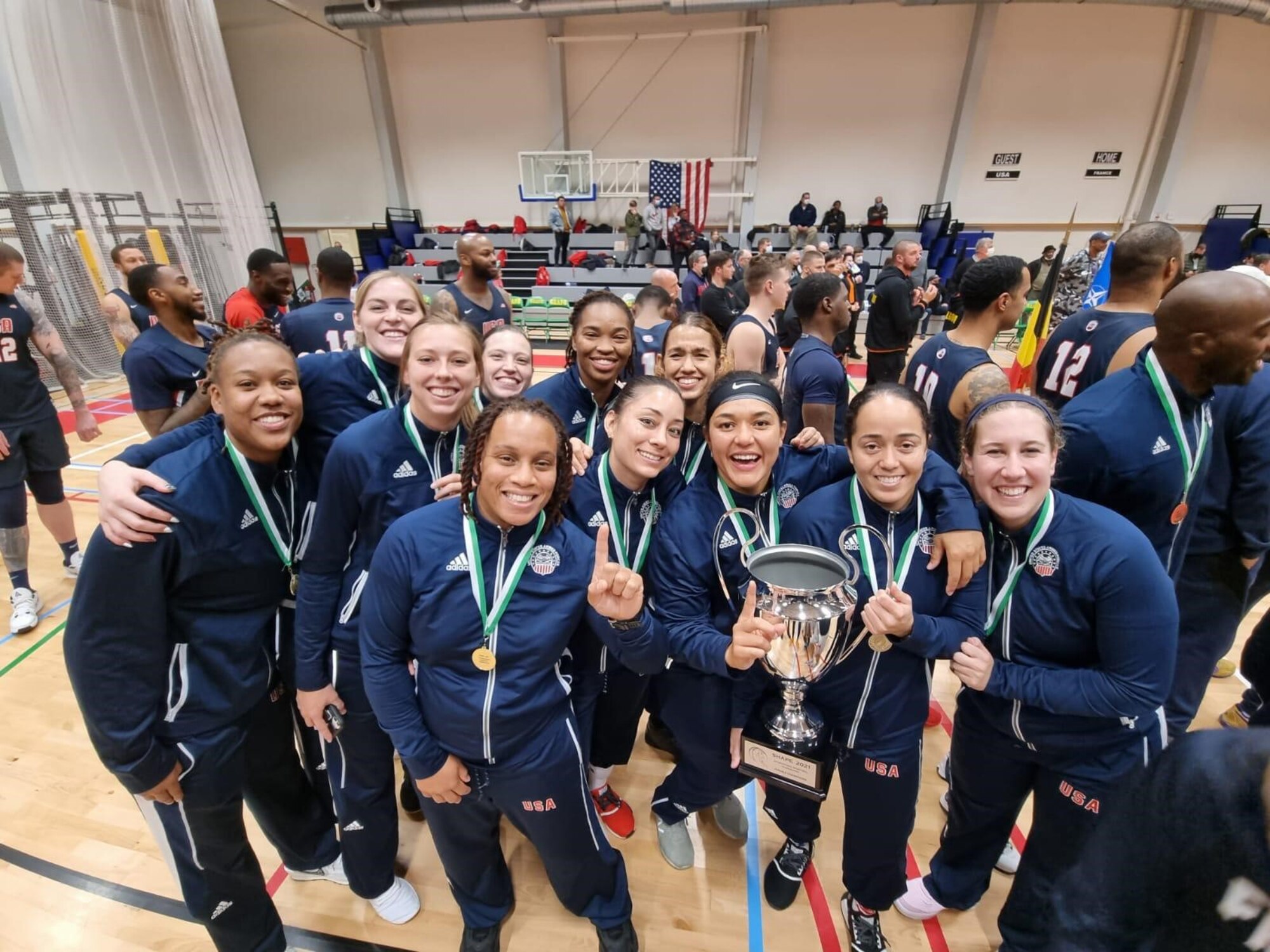 U.S. Armed Forces Women’s Basketball Team poses with trophy.