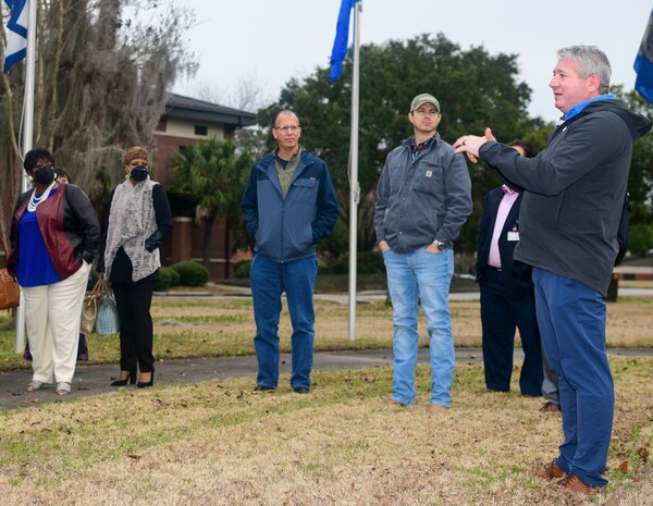 Team Charleston Airmen escort attendees of Clergy Day down the ramp of a C-17 Globemaster III static display at Joint Base Charleston, S.C., Jan 25, 2022.