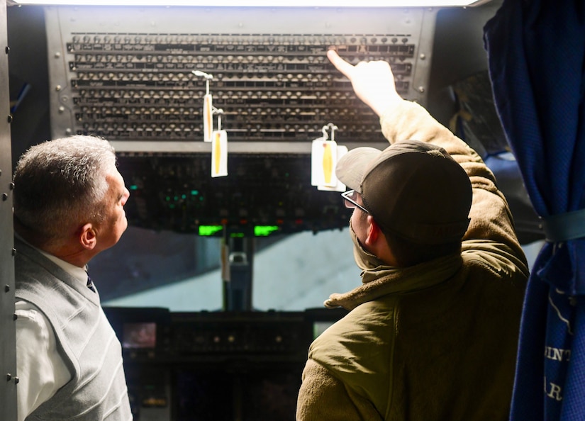 Team Charleston Airmen escort attendees of Clergy Day down the ramp of a C-17 Globemaster III static display at Joint Base Charleston, S.C., Jan 25, 2022.