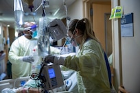 U.S. Army 1st Lt. Kristian Hill, a registered nurse assigned to 14th Field Hospital, transports a patient during the COVID response operations at Lifespan Community Health Institute in Providence, Rhode Island, Jan. 24, 2022. U.S. Northern Command, through U.S. Army North, remains committed to providing flexible Department of Defense support to the whole-of-government COVID response. (U.S. Army photo by Sgt. Kaden D. Pitt)
