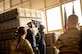 honorguardsman holds flag above her head during a flag folding ceremony